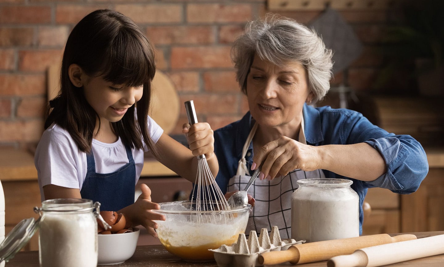 Grandparent baking with her grandchild