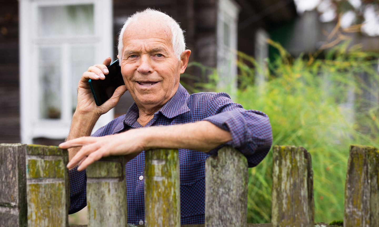 Person living in a rural area speaks on the phone with a care coordinator.