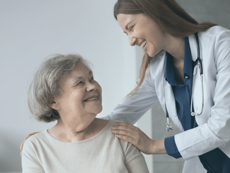 Nurse and patient laughing